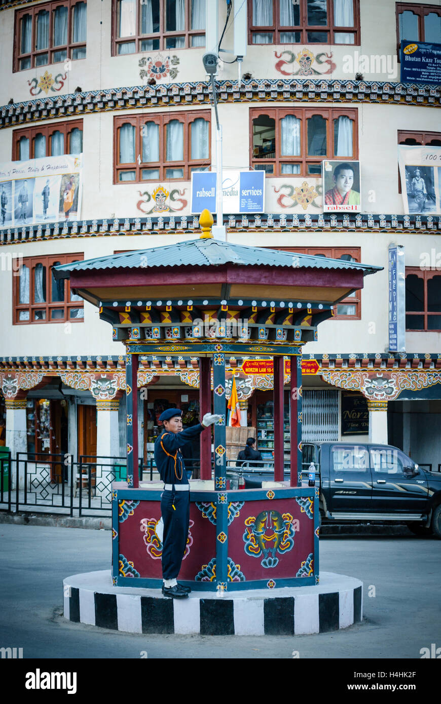 Traffic policeman directing traffic from ornate traffic circle in Thimphu, Bhutan. Stock Photo