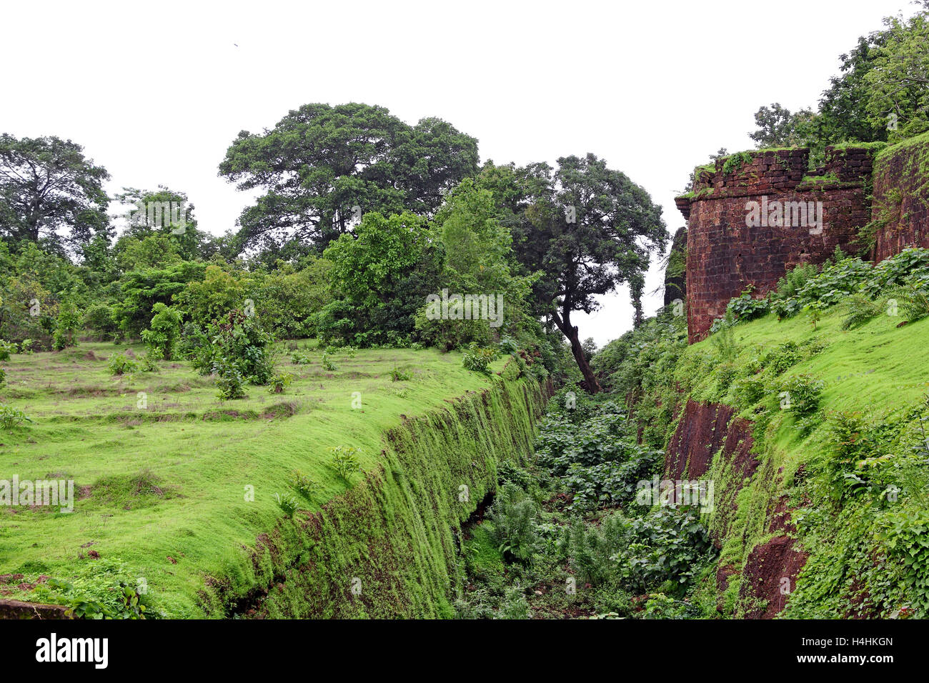 Remains of the deep trench made around for security in Cabo de Rama Fort in Goa, India. Stock Photo