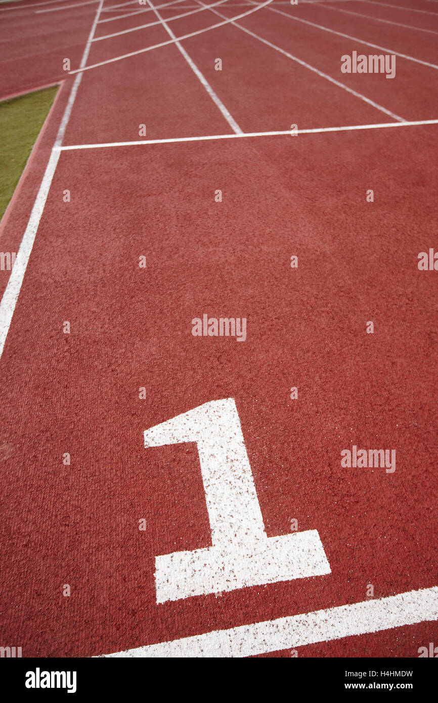 Number one signpost in an athletic running track. Vertical Stock Photo