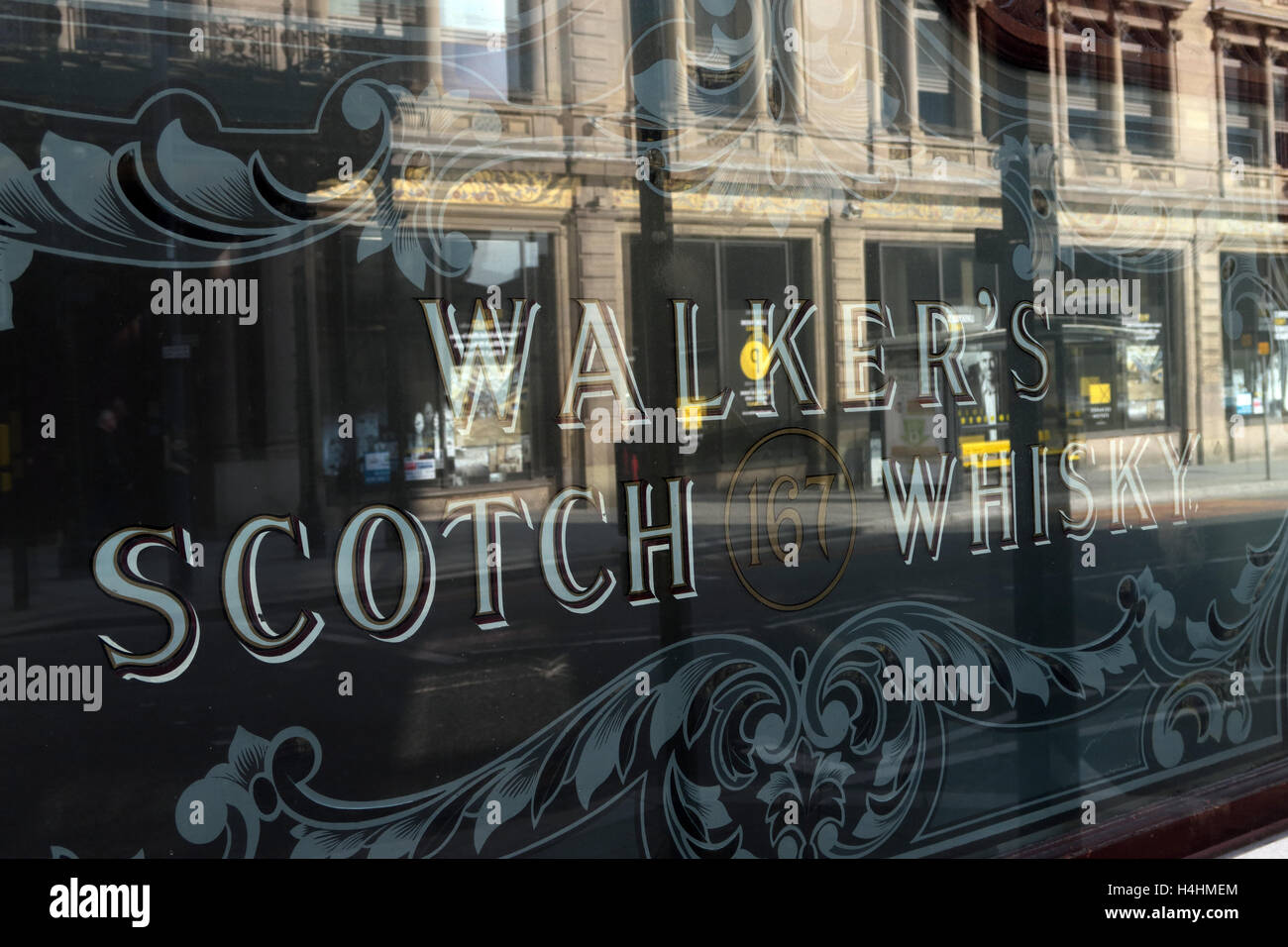 Walkers Scotch Whisky Window, in pub, reflecting a building, Liverpool, Merseyside, England , UK Stock Photo