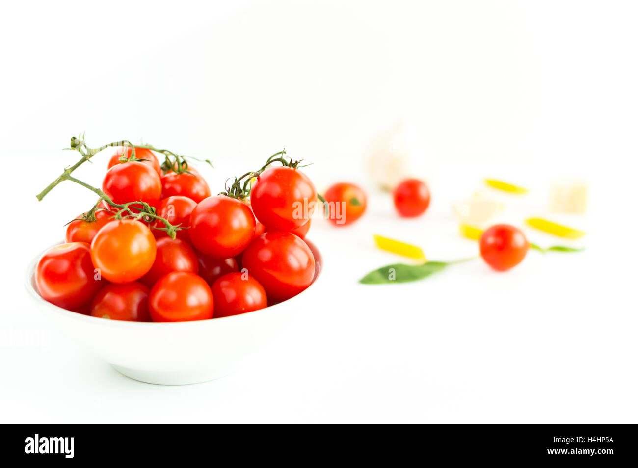 Italian red tomatoes close up food with pasta, basil leafs, cheese, isolated on white background Stock Photo