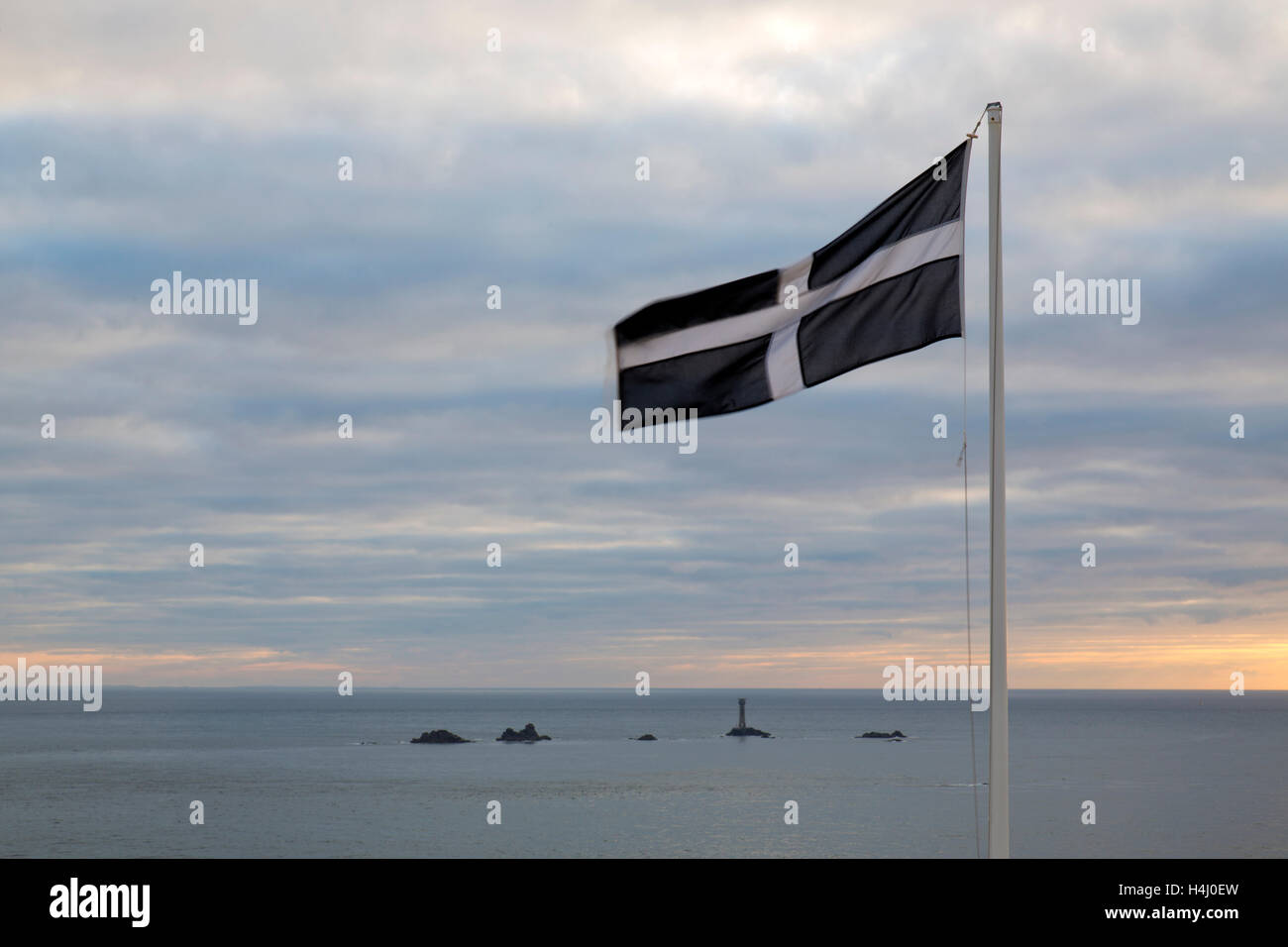 Cornish Flag; Land's End; Looking towards Longships Lighthouse; Cornwall; UK Stock Photo