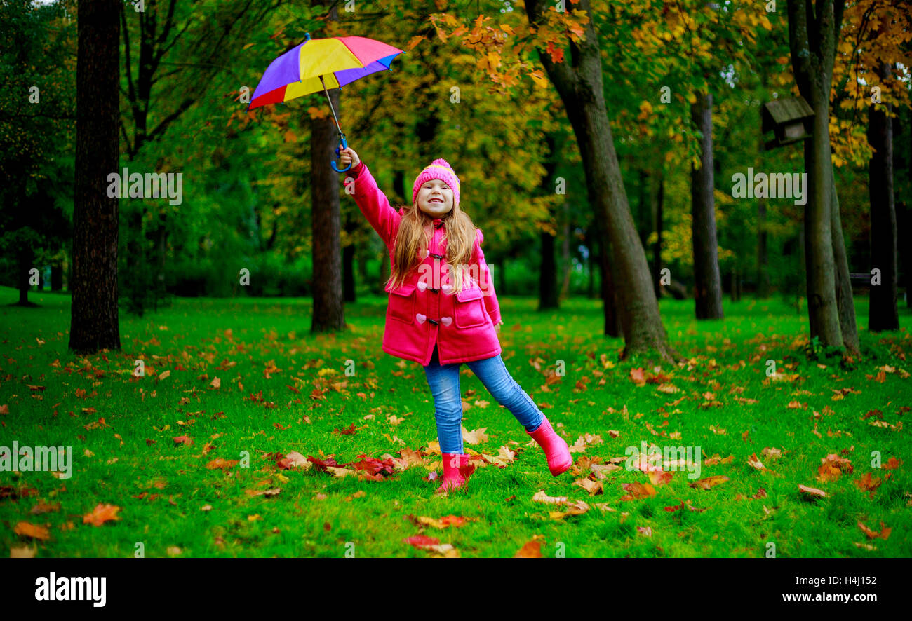 Girl child in autumn forest with umbrella hi-res stock photography and ...