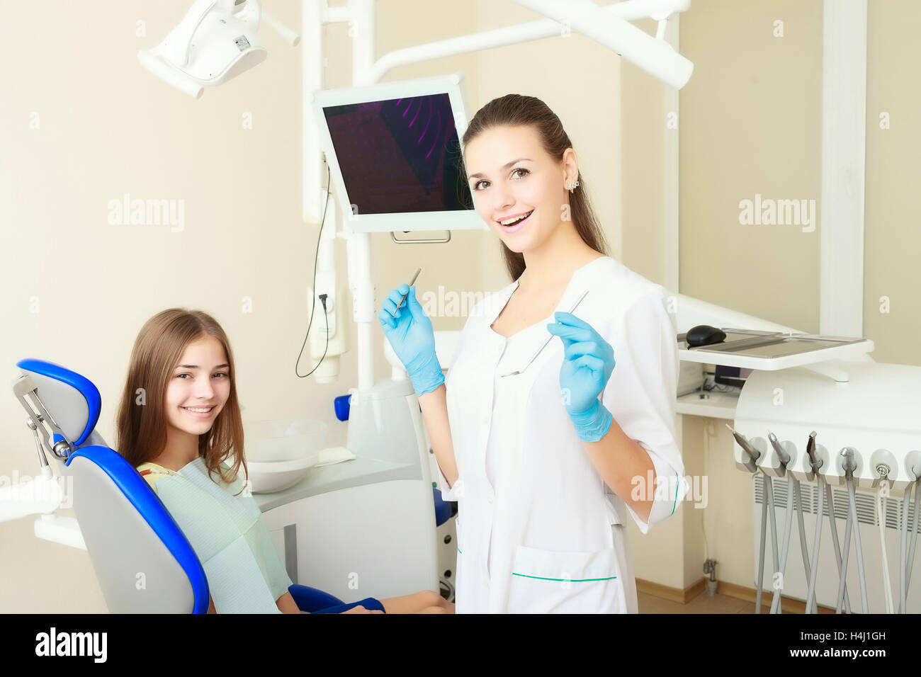 attractive woman dentist with girl patient Stock Photo Alamy