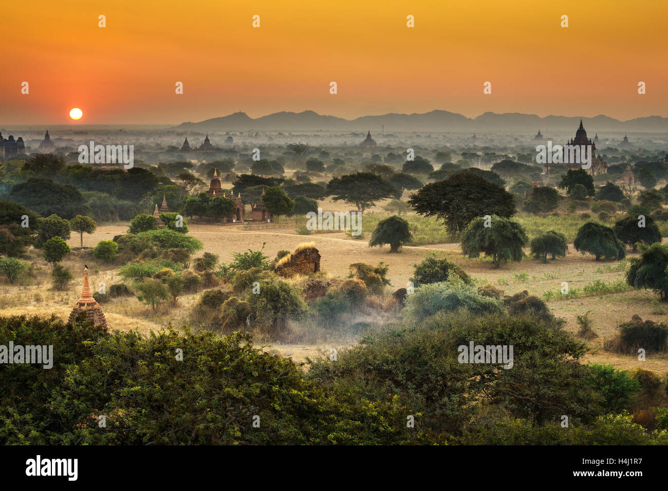 Scenic sunrise above Bagan in Myanmar. Bagan is an ancient city with thousands of historic buddhist temples and stupas. Stock Photo