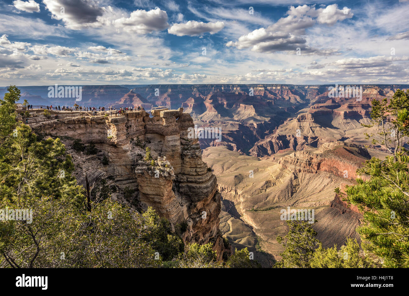 Tourists looking at  skyline scenery of Grand Canyon National Park from point of view named 'Mather Point'. Stock Photo