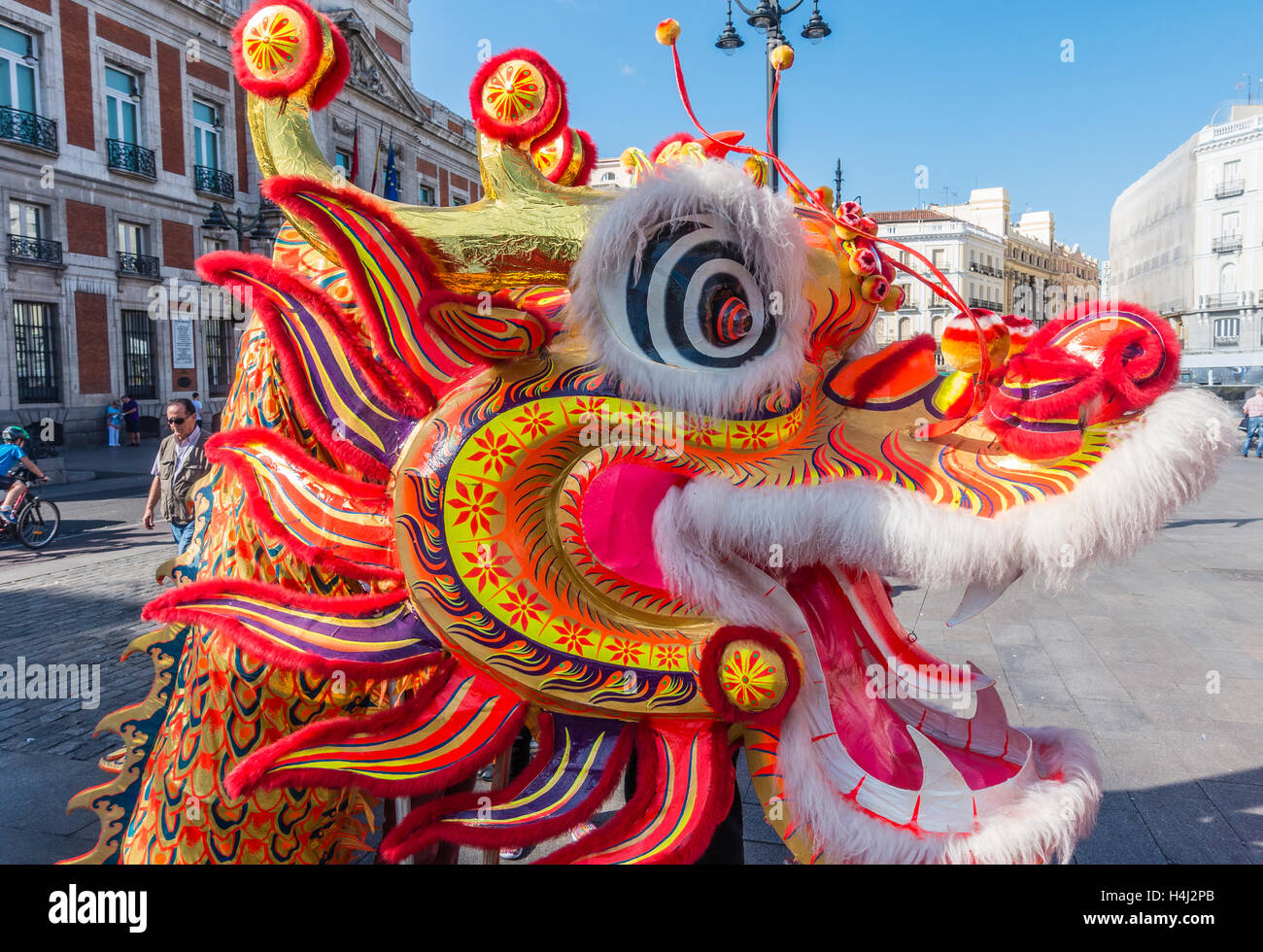 Close-up of dragon's head in the Chinese dragon dance in Puerta del Sol, Madrid, Spain. Stock Photo