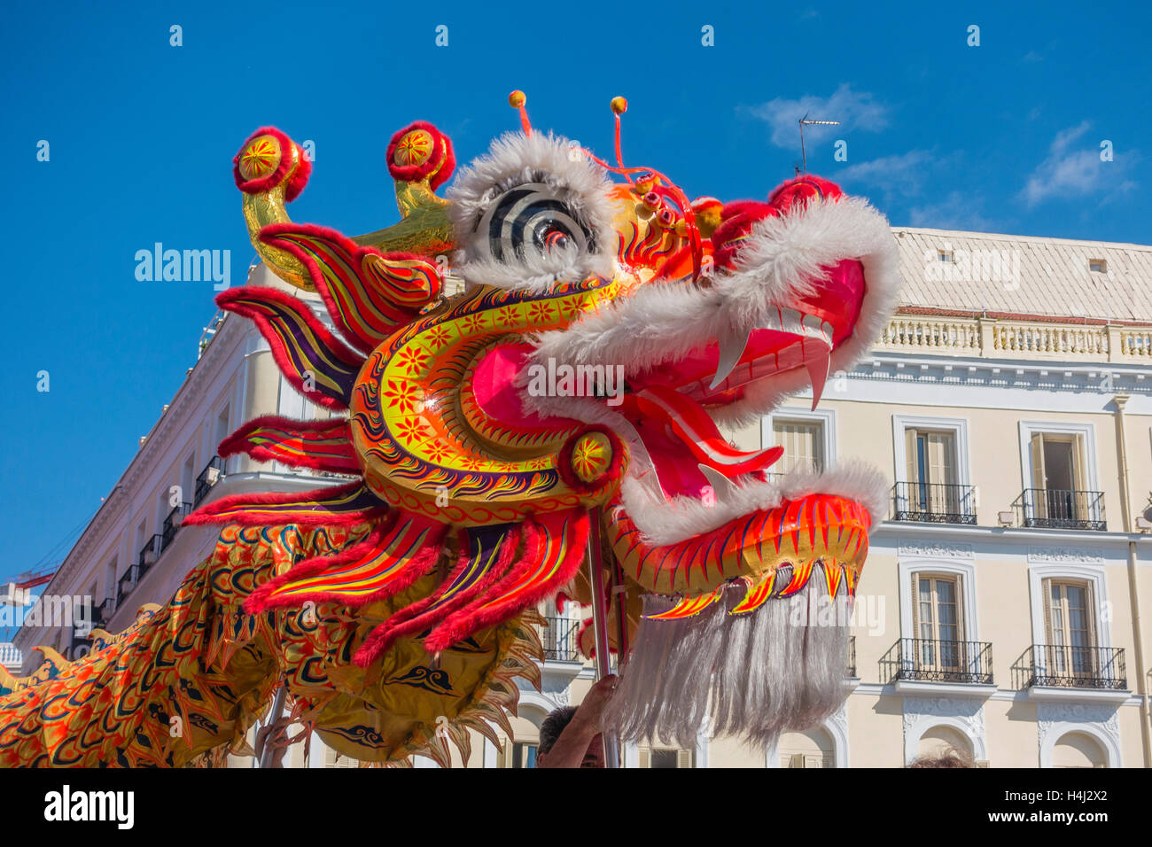 Close-up of dragon's head in the Chinese dragon dance in Puerta del Sol, Madrid, Spain. Stock Photo