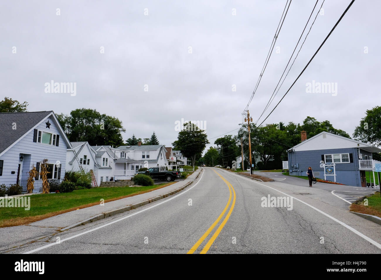 Classic double yellow lines seen on a highway in a town in the United