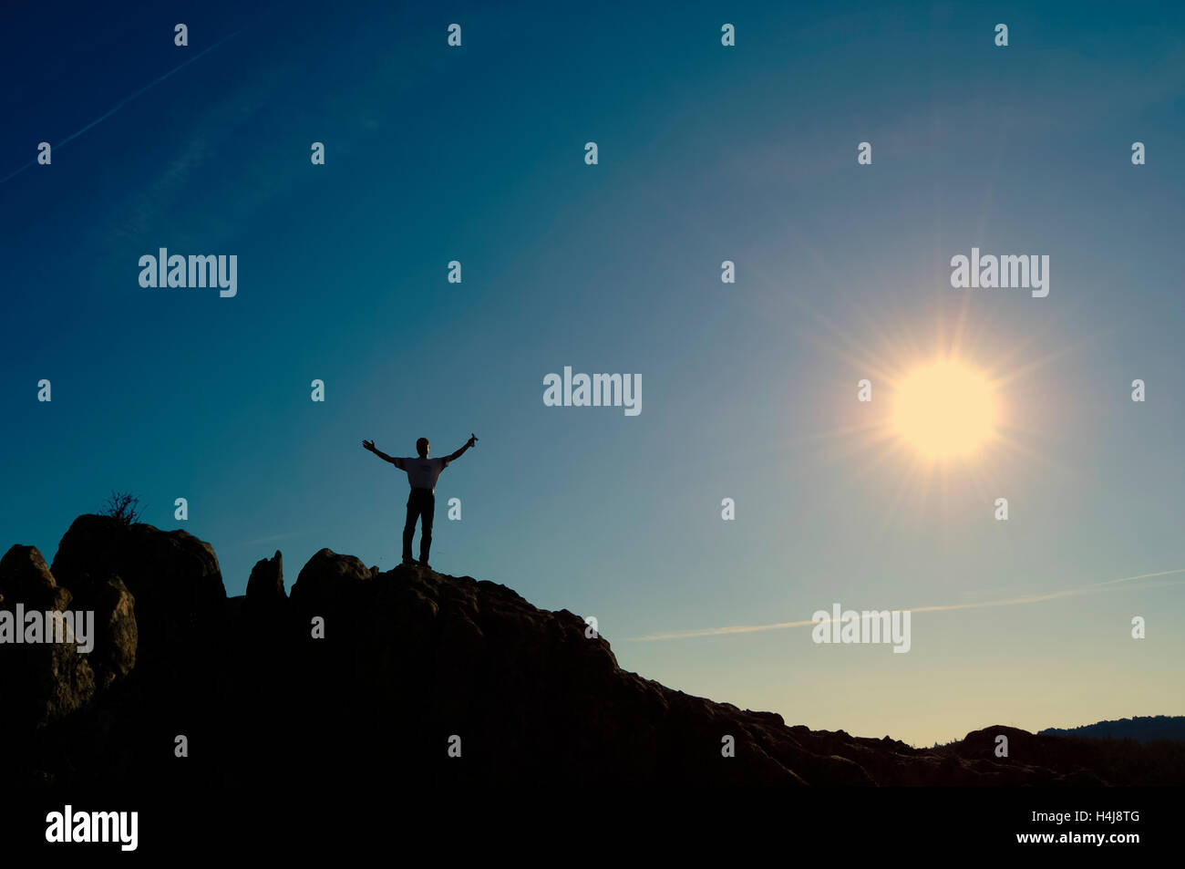 Winner silhouette on the mountain top. Sport and active life concept Stock Photo