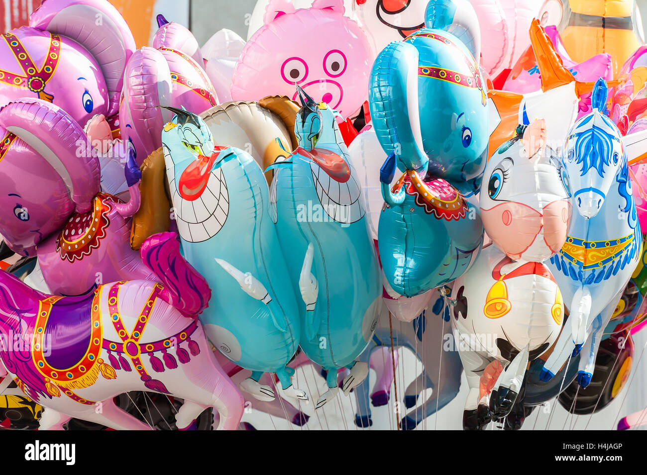Bunch of balloons in the shape of animals. Colored background Stock Photo