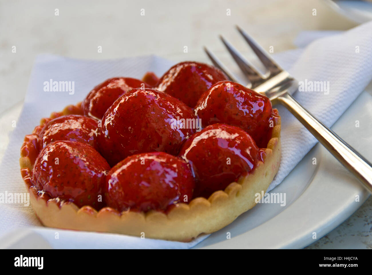 Tarte au fraises, typical french strawberry tart on outdoor cafe table, Beaune, Burgundy, France Stock Photo
