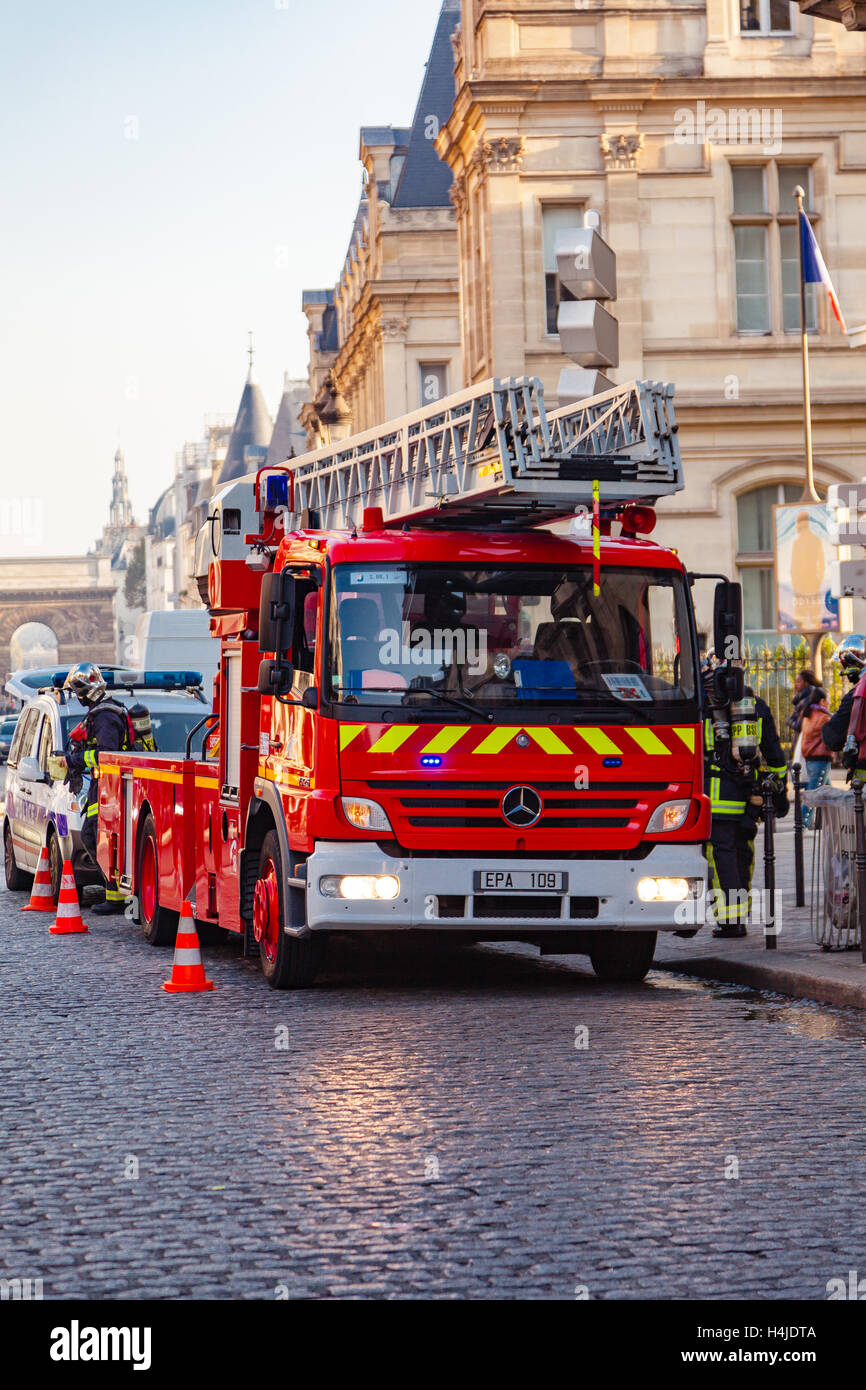 fireman in his fire truck in the street of Paris, France. Stock Photo