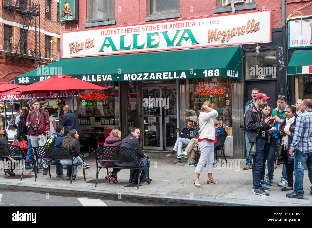 Tourists gathered outside Alleva Italian deli on Grand Street in Little Italy in New York City Stock Photo