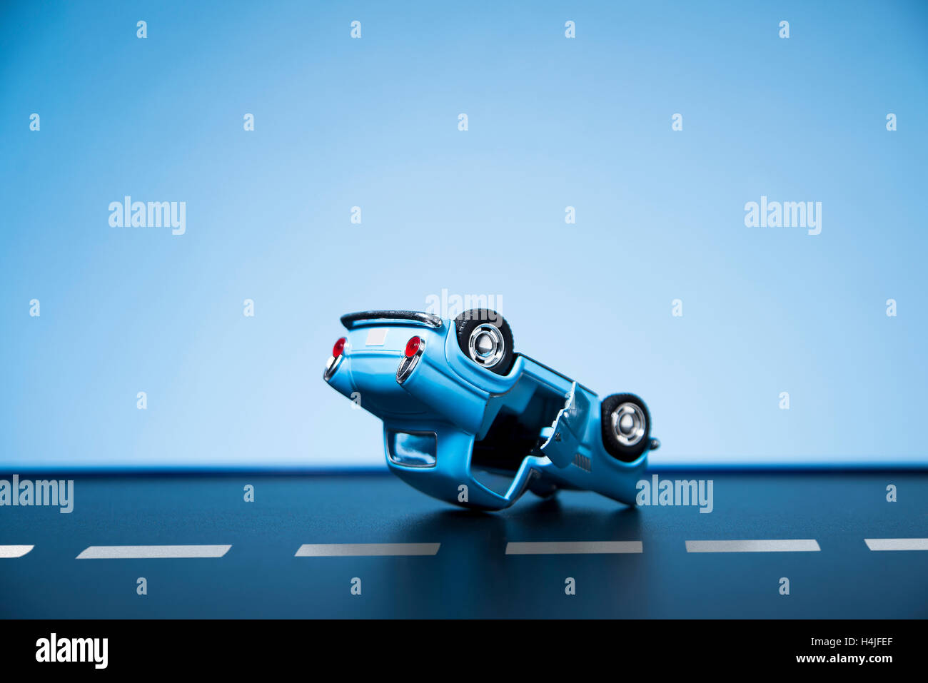 Classic fifties scale model toy car accident on the road Stock Photo