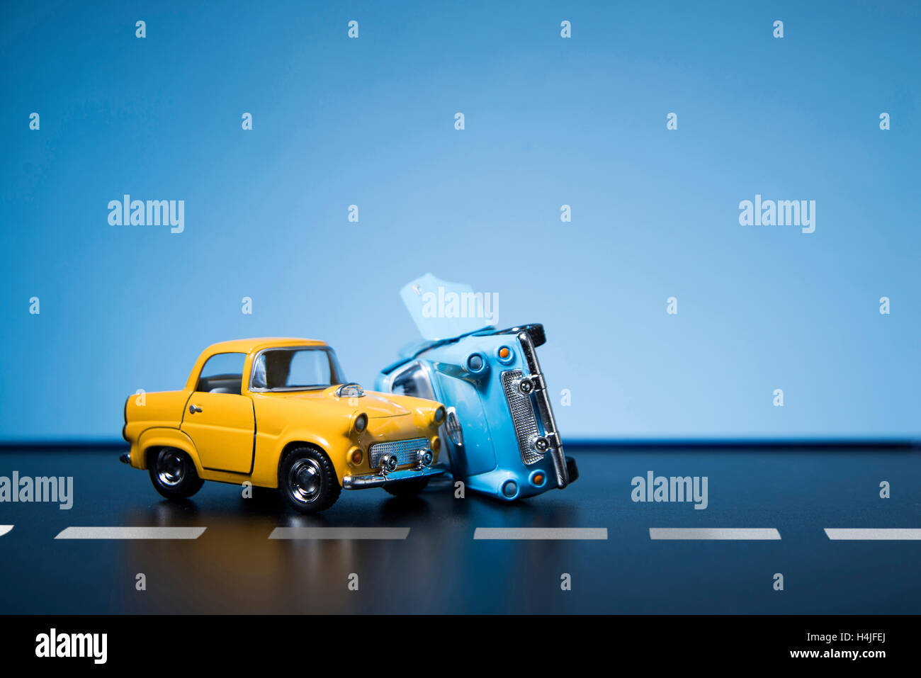 Classic fifties scale model toy cars accident on the road Stock Photo