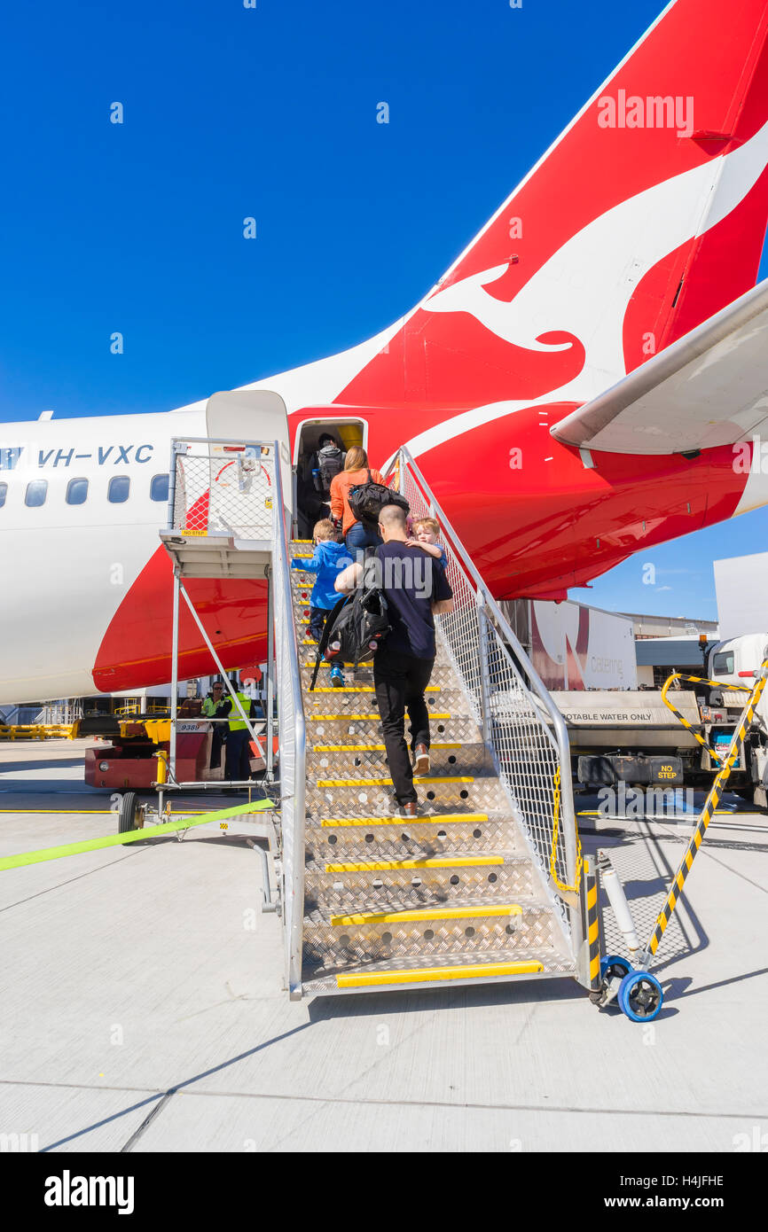 Passengers boarding the Qantas aircraft at Melbourne Airport Stock