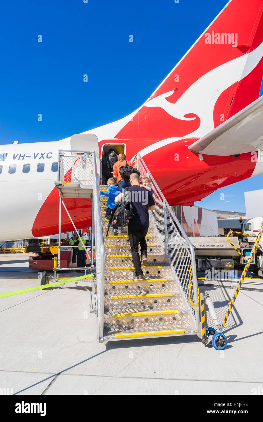 Passengers boarding the Qantas aircraft at Melbourne Airport Stock Photo