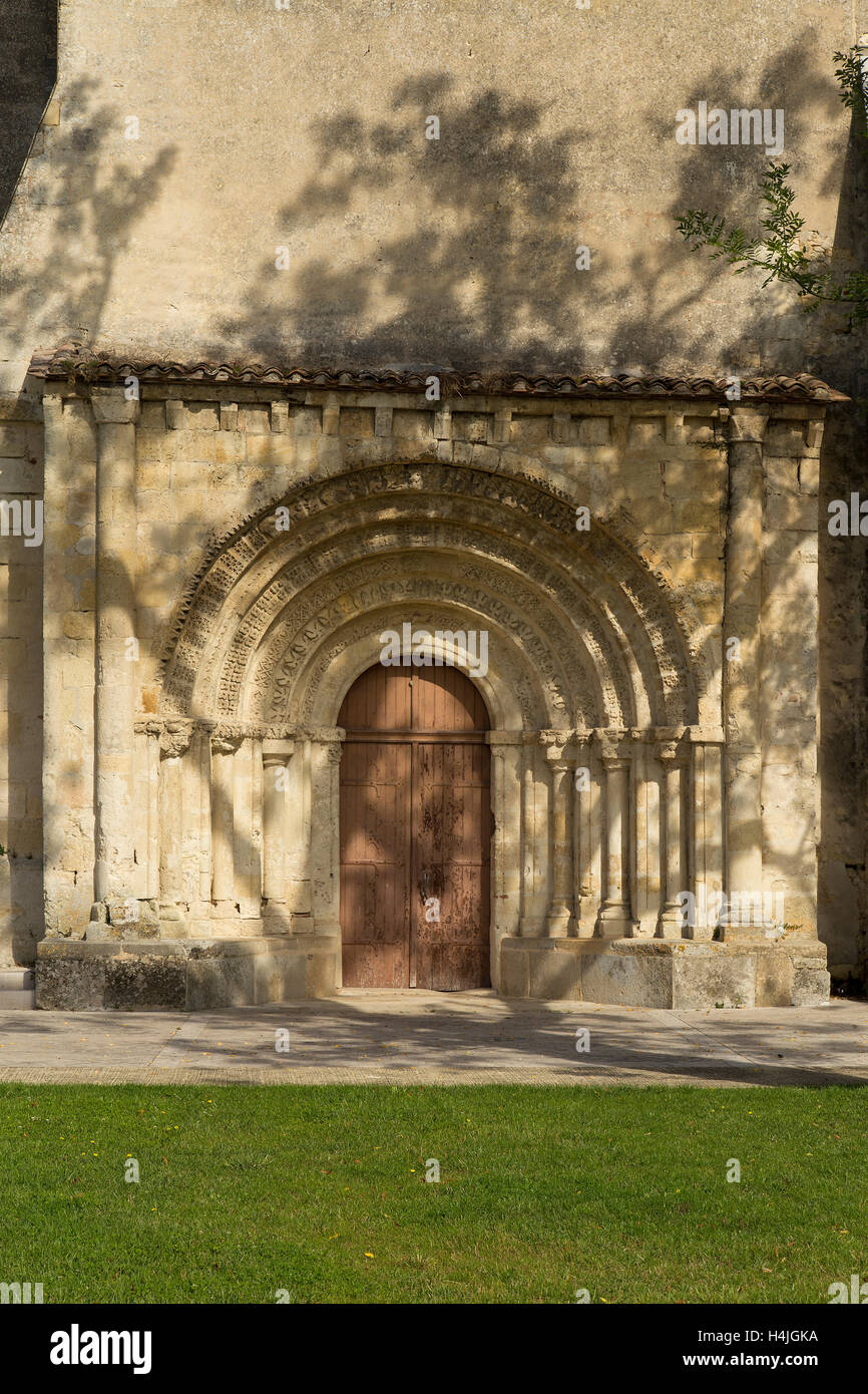 Carved stone arched doorway in French church Norman architecture Stock Photo