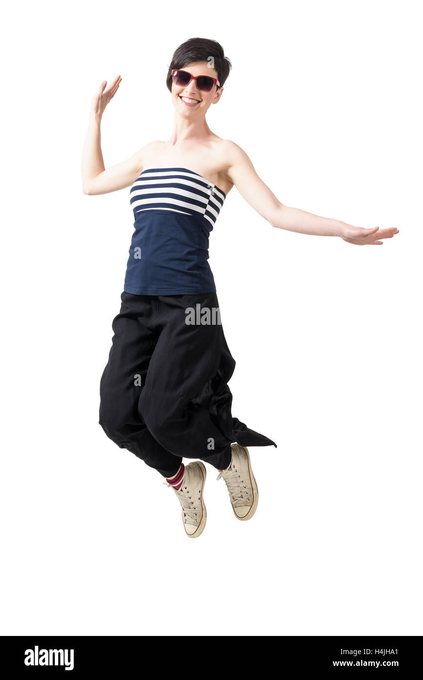 Happy Excited Trendy Short Hair Woman Jumping In Mid Air