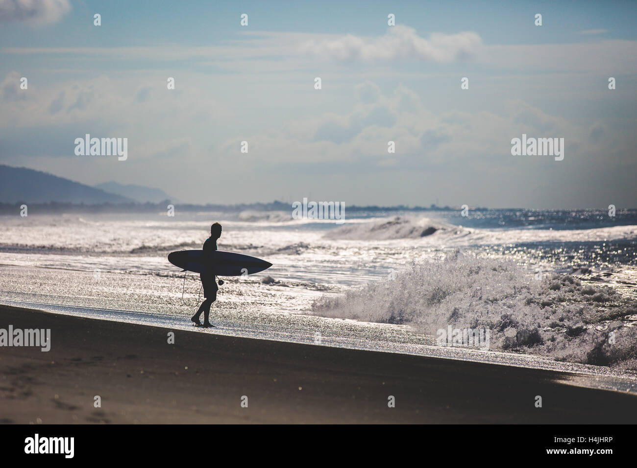 Girl on longboard surfing bali hires stock photography and images Alamy