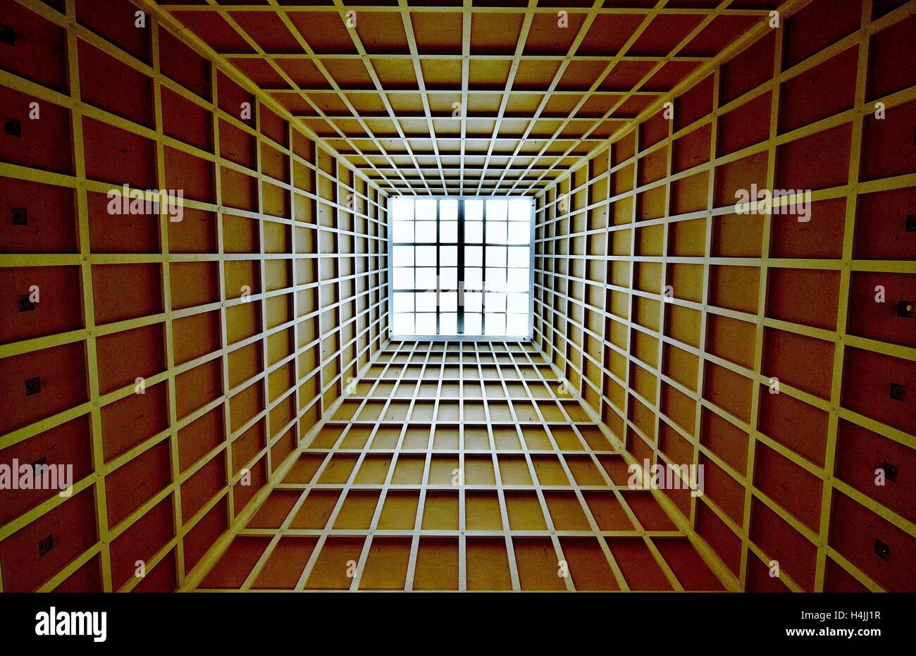 Abstract perspective of a high ceiling with vertical skylight with strong symmetry and geometry Stock Photo