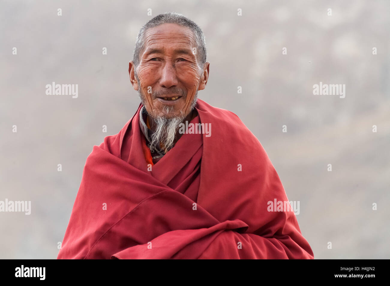 Portrait of a old monk Stock Photo - Alamy