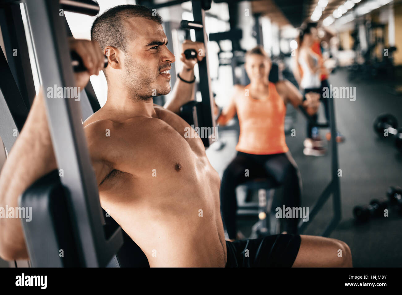 Determined athlete pushing the limits in gym Stock Photo