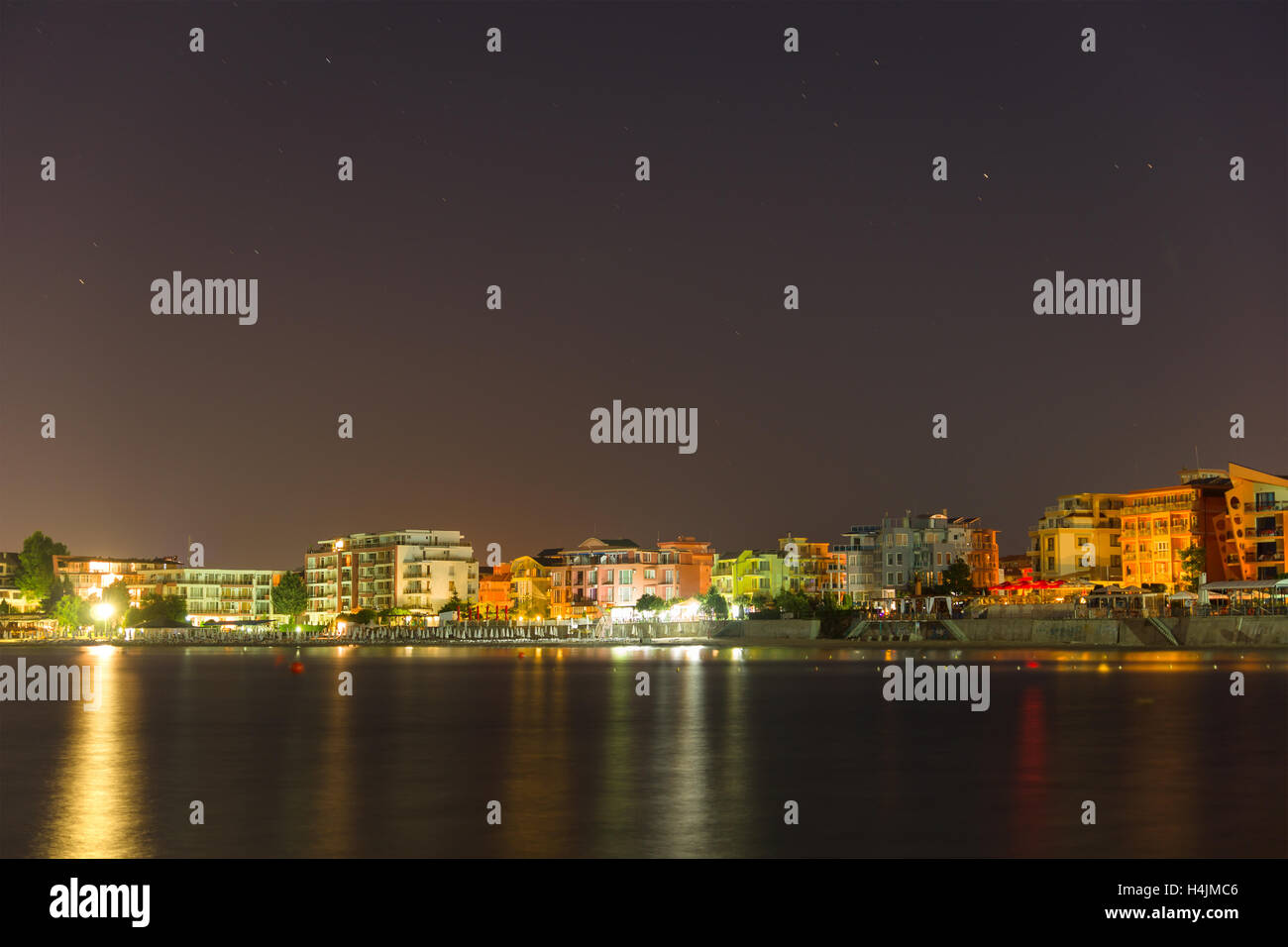 Sea view from the city at night with colored lights Stock Photo