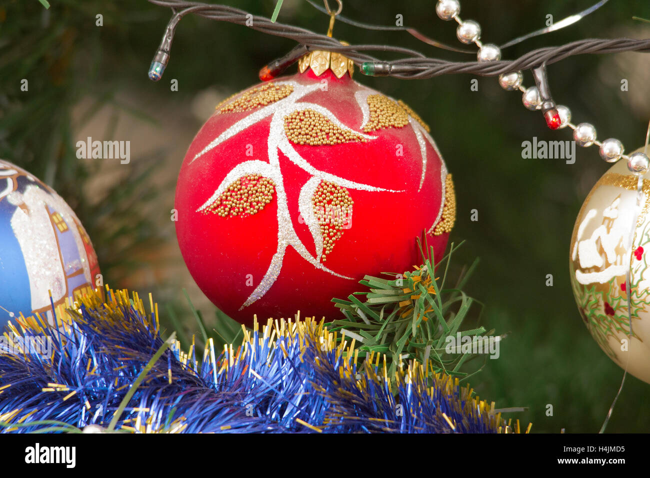 colorful Christmas decorations hung on the branches of trees Stock