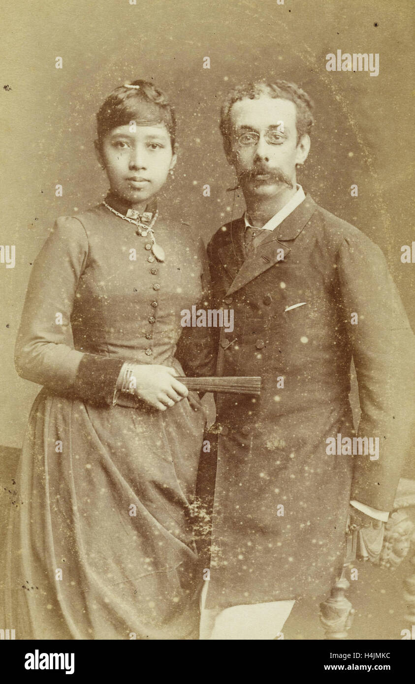Studio Portrait of a couple, a Javanese woman and a European man, Woodbury & Page, 1890-1915 Stock Photo