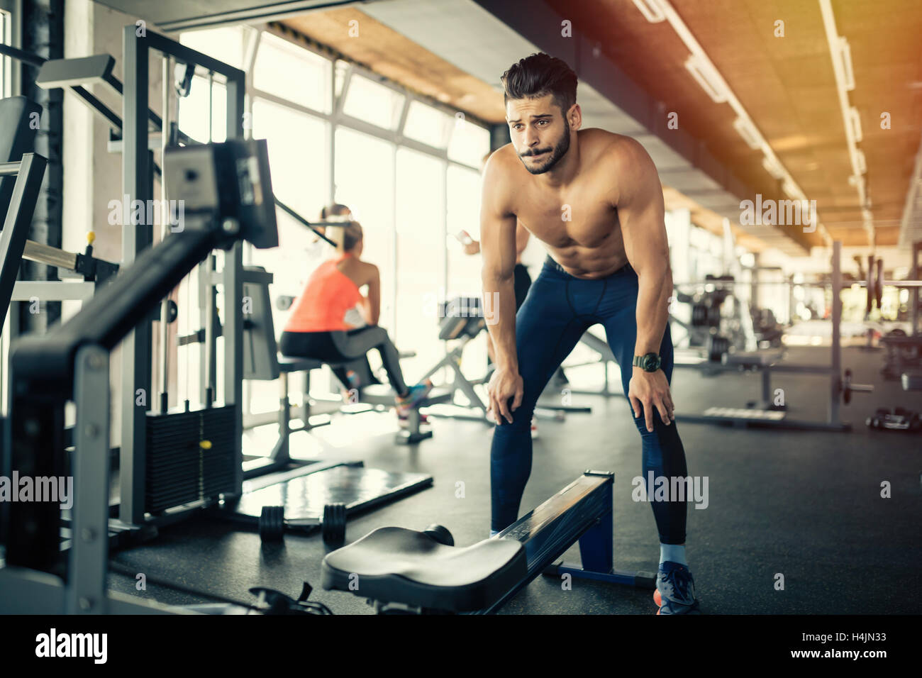 Exhausted athlete working out in gym Stock Photo Alamy