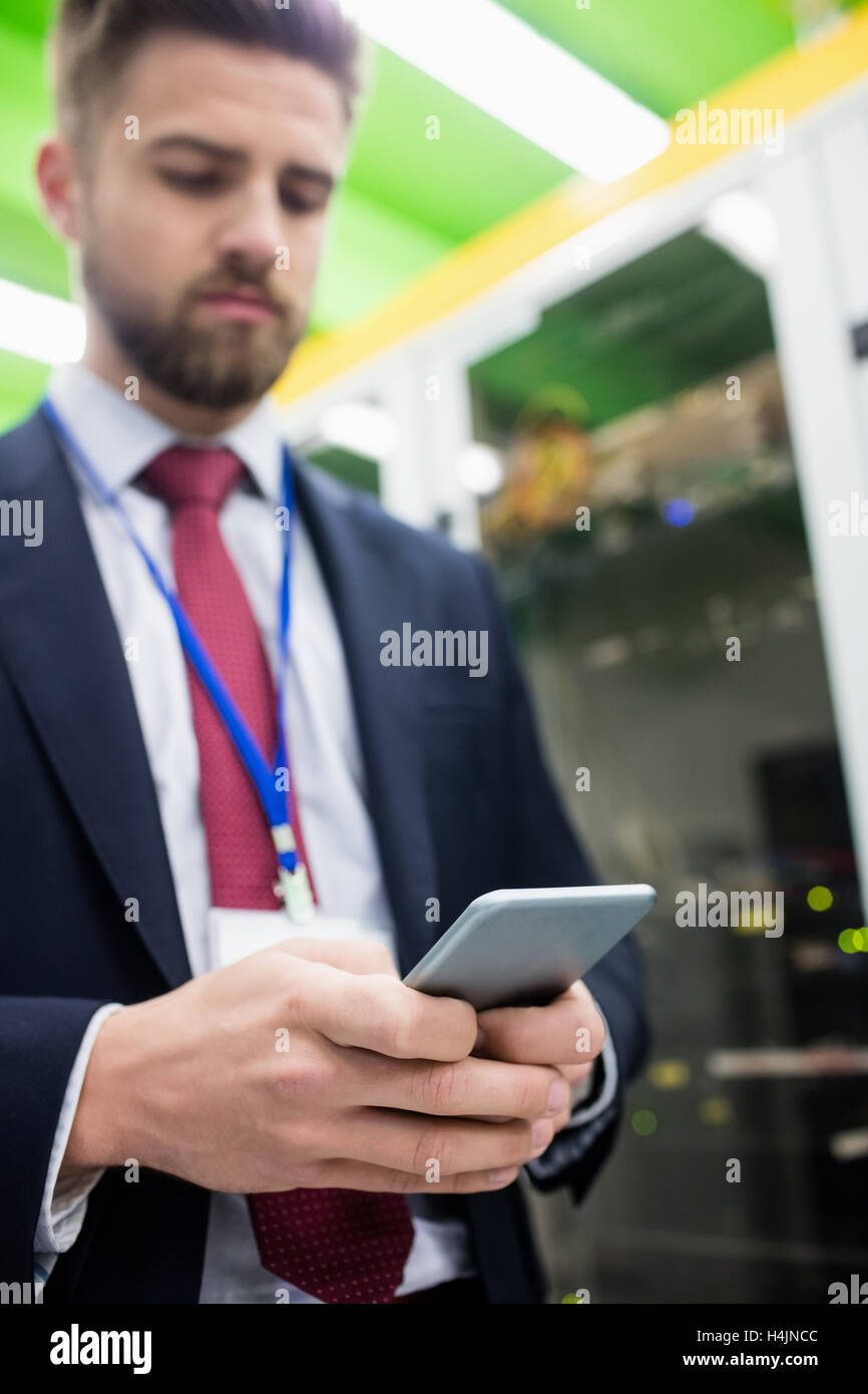 Technician using mobile phone Stock Photo Alamy