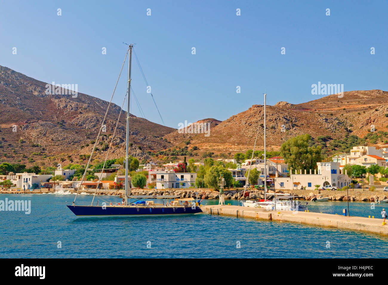 Tilos town quay on the Greek island of Tilos situated between Rhodes and Kos in the Dodecanese Island group, Greece. Stock Photo