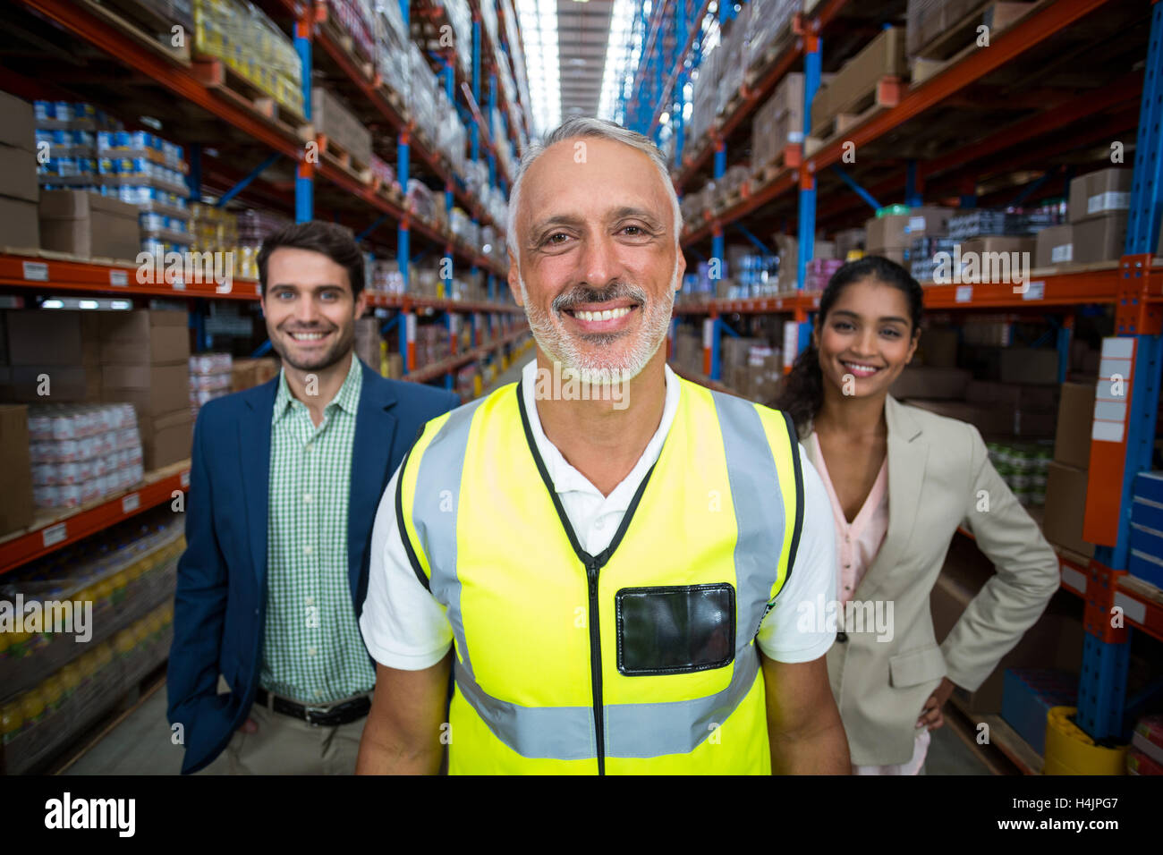 Portrait of warehouse team standing together Stock Photo - Alamy