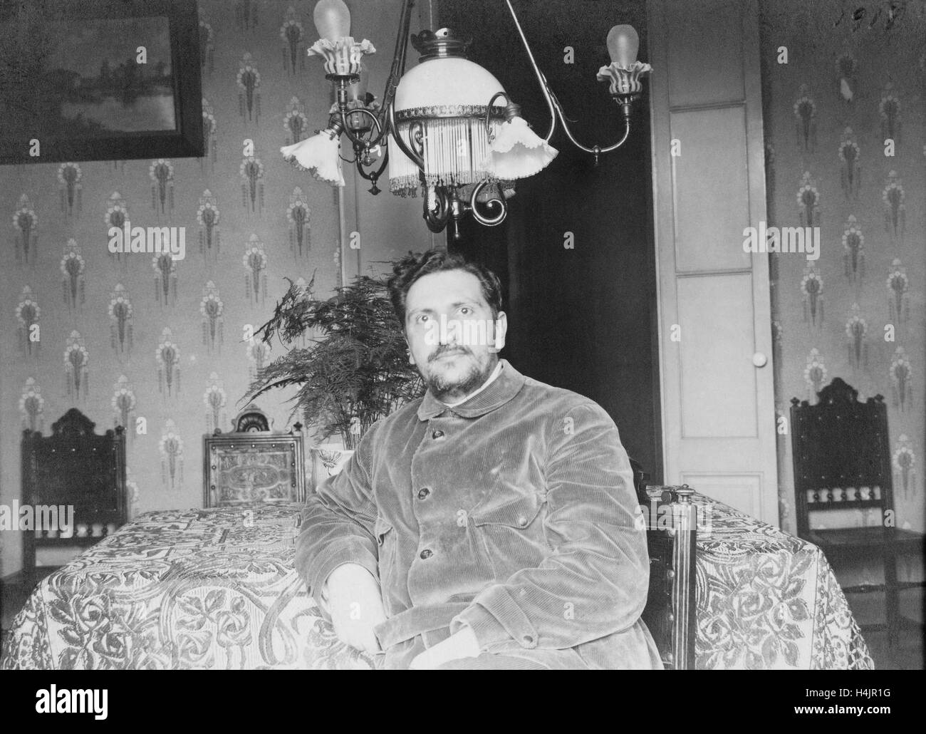 Old Portrait of a man. Vintage. Year 1920. House decoration old. Looking at camera. Stock Photo