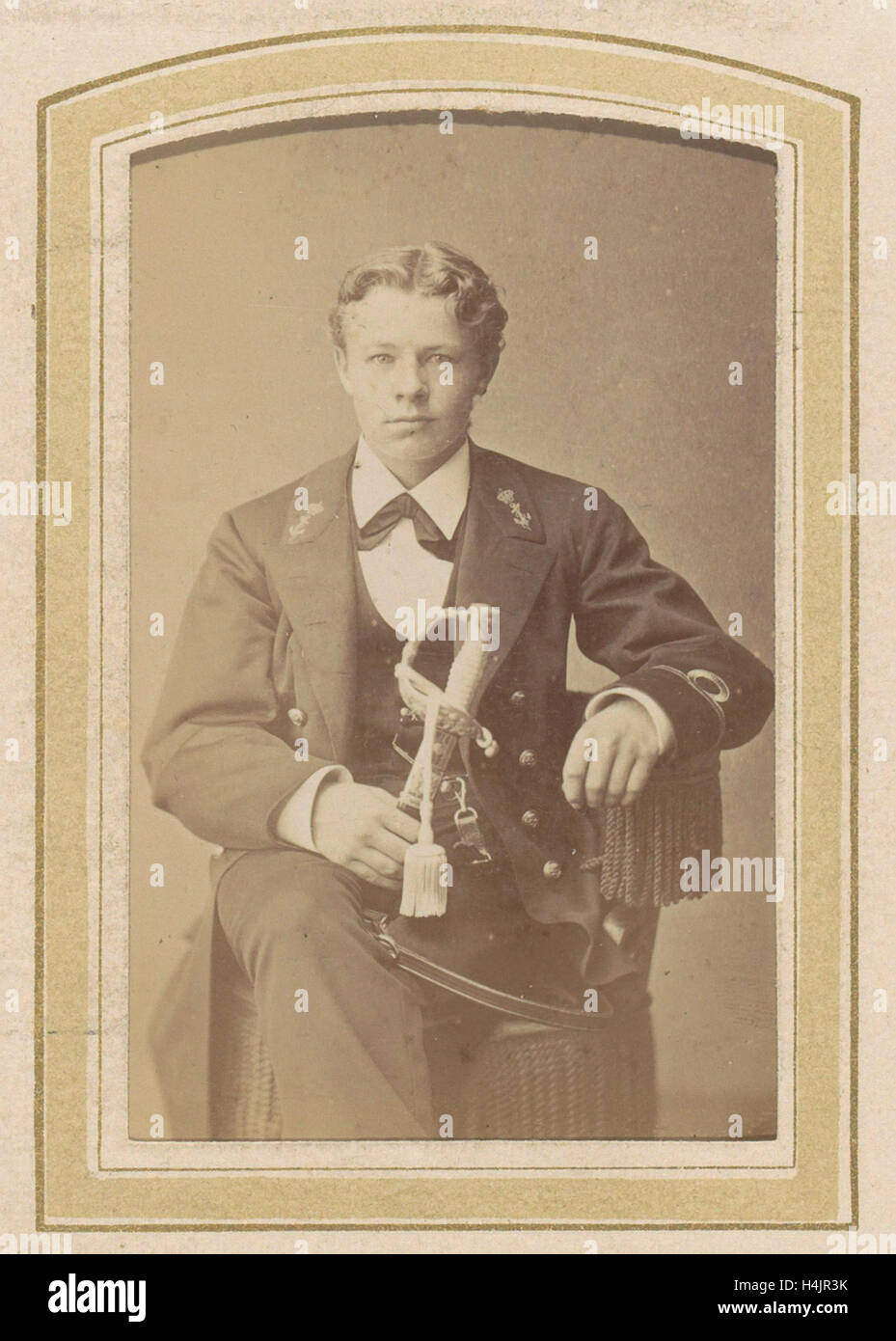 Portrait of a seated young man with a saber, Abraham Koorenhoff, sep-1880 Stock Photo