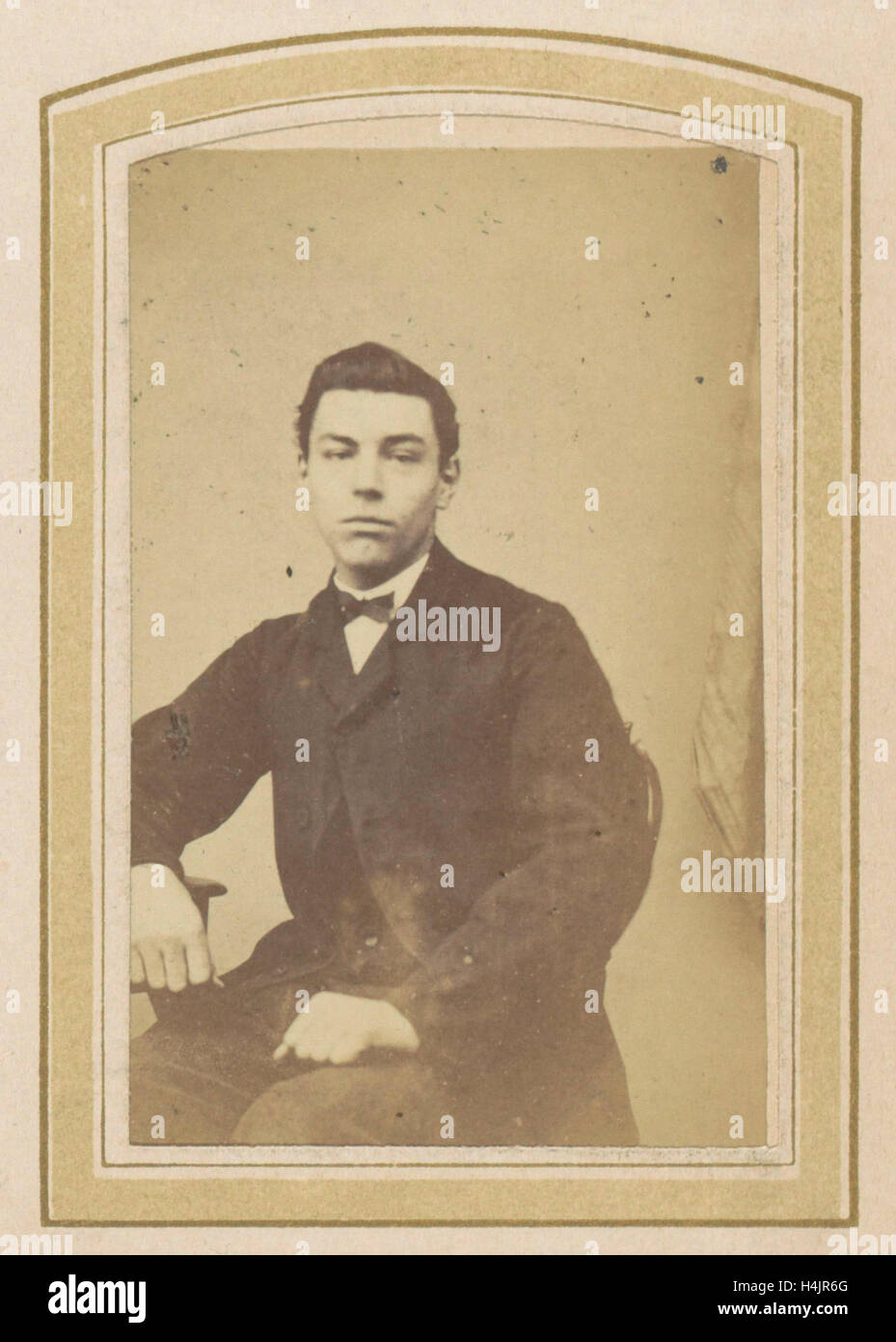 Portrait of a young man with a bow tie and a jacket, Anonymous Stock ...