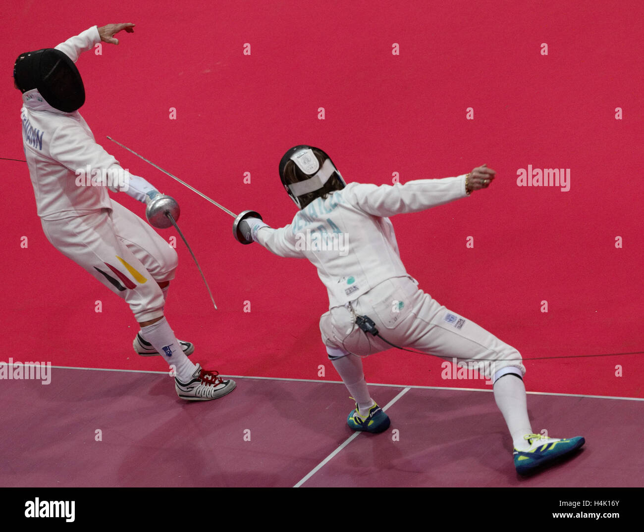 German fencer Ute Schiffmann (sword, l) in a fight against Marie-Chantal Demaille during the team battle at the Fencing World Championships of senior citizens in Stralsund, Germany, 13 October 2016 . Photo: Peter Endig/dpa - NO WIRE SERVICE- Stock Photo