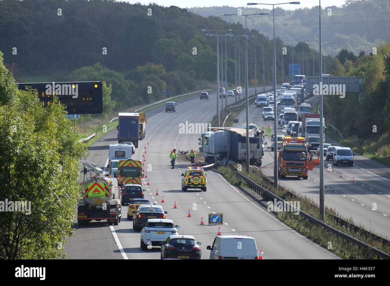 Lorry crashed into the central reservation on the m1 motorway between j23 and j23a causing tailbacks both north and southbound Stock Photo