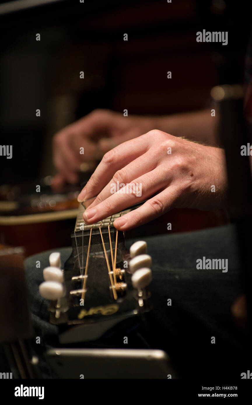 Two male hands playing slide guitar Stock Photo Alamy