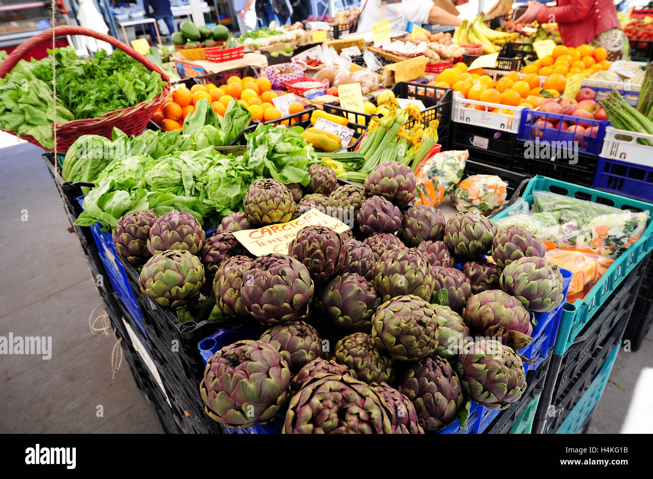 A display of artichokes at a fruit and veg stall at the Trastevere market in Rome, Italy Stock