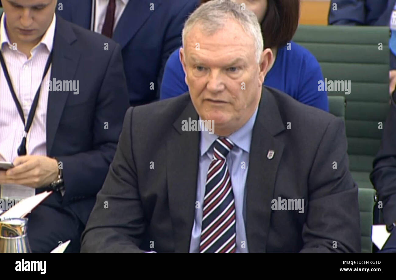 Football Association chairman Greg Clarke answers questions in front of the Commons Culture, Media and Sport select committee in London where he was asked to launch an independent inquiry into allegations of corruption within the game. Stock Photo