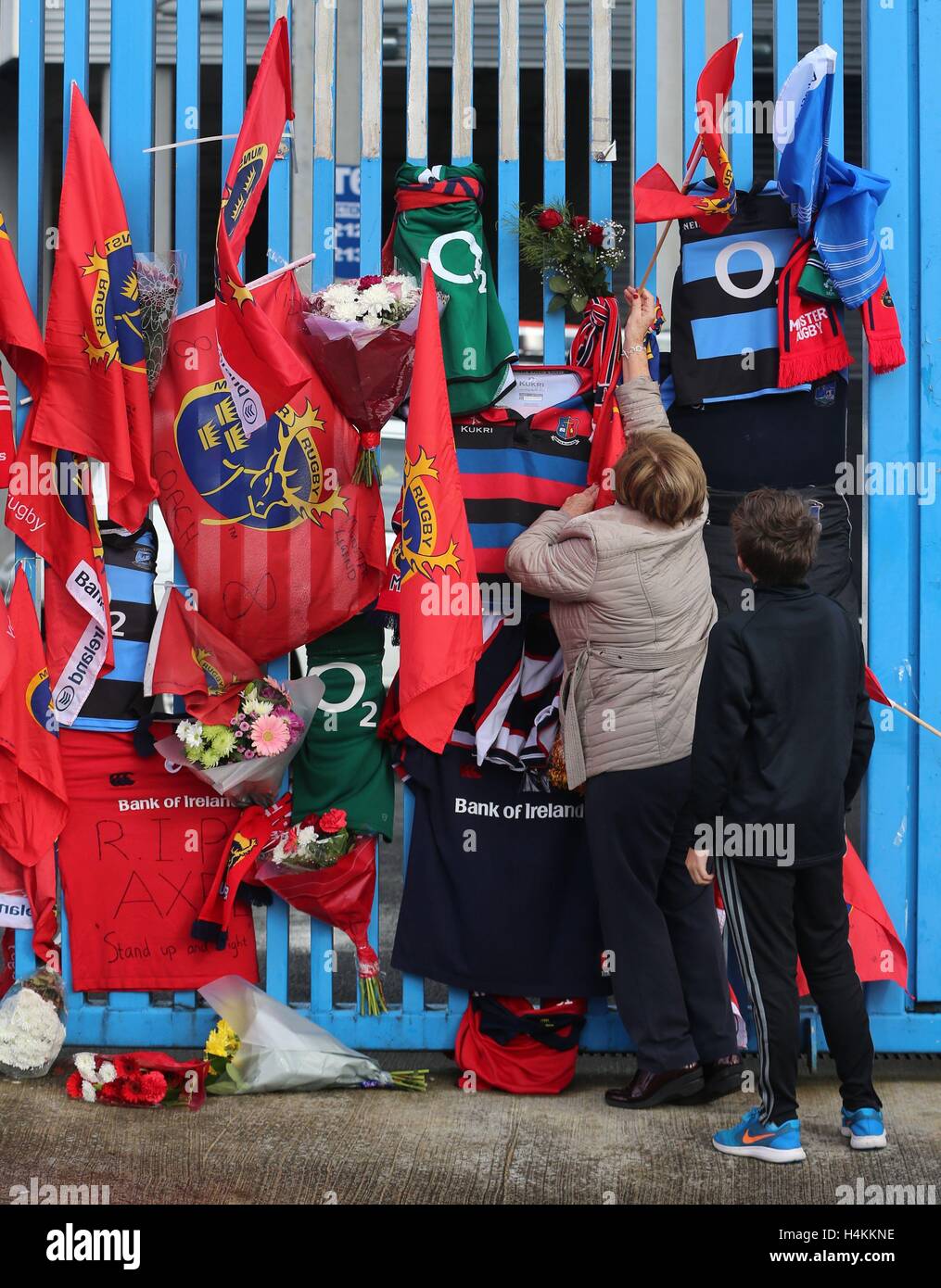 Munster Rugby fans pay tribute to former Ireland and Munster star Anthony Foley outside Thomond Park in Limerick, after the 42-year-old head coach was found dead in the province's team hotel in Paris on Sunday, hours before the team were due to take to the pitch in the European Champions Cup. Stock Photo