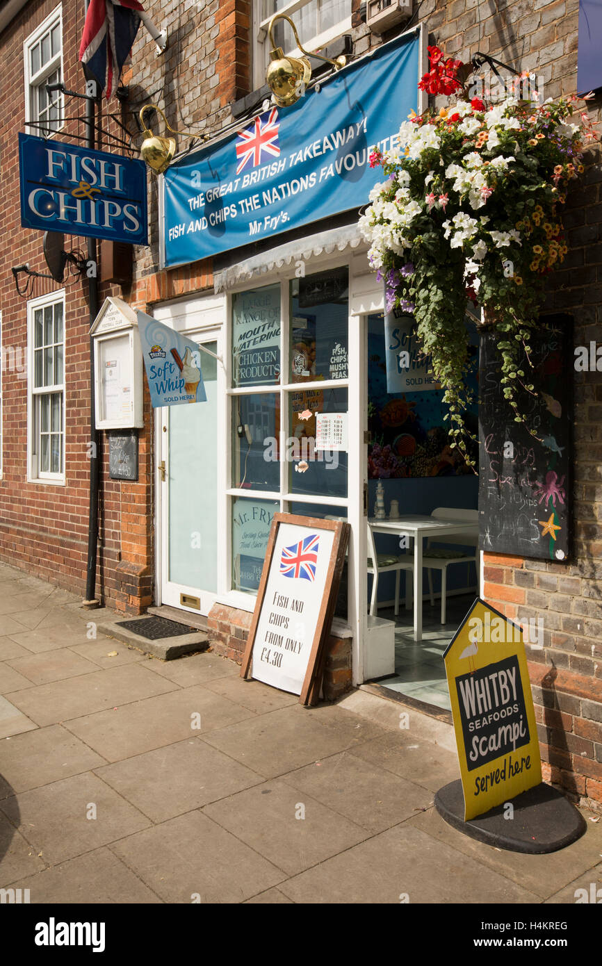 England, Berkshire, Hungerford, High Street, floral display outside Mr Fry's fish and chip shop Stock Photo