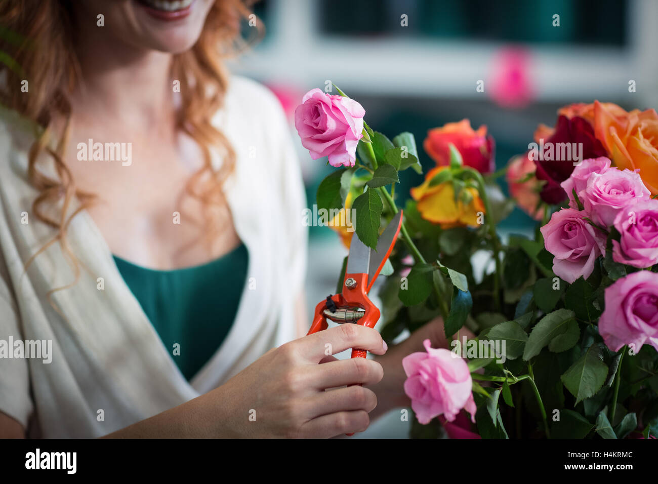 Female florist preparing flower bouquet Stock Photo - Alamy