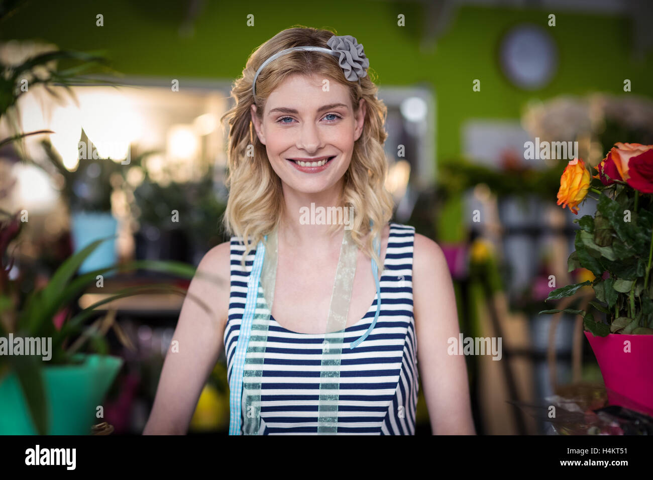 Portrait of female florist smiling Stock Photo