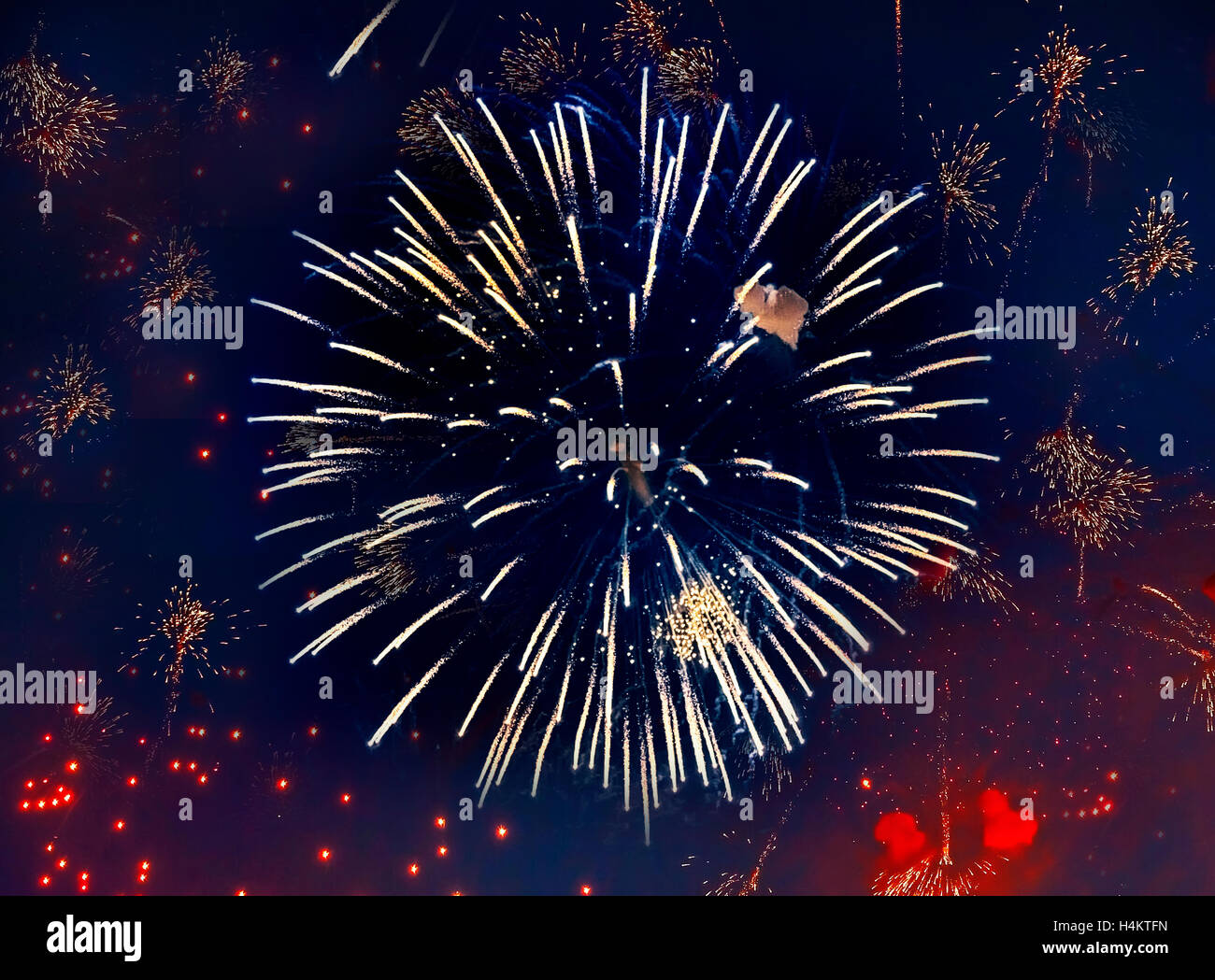 Beauty volleys of celebratory colorful fireworks in night sky Stock Photo