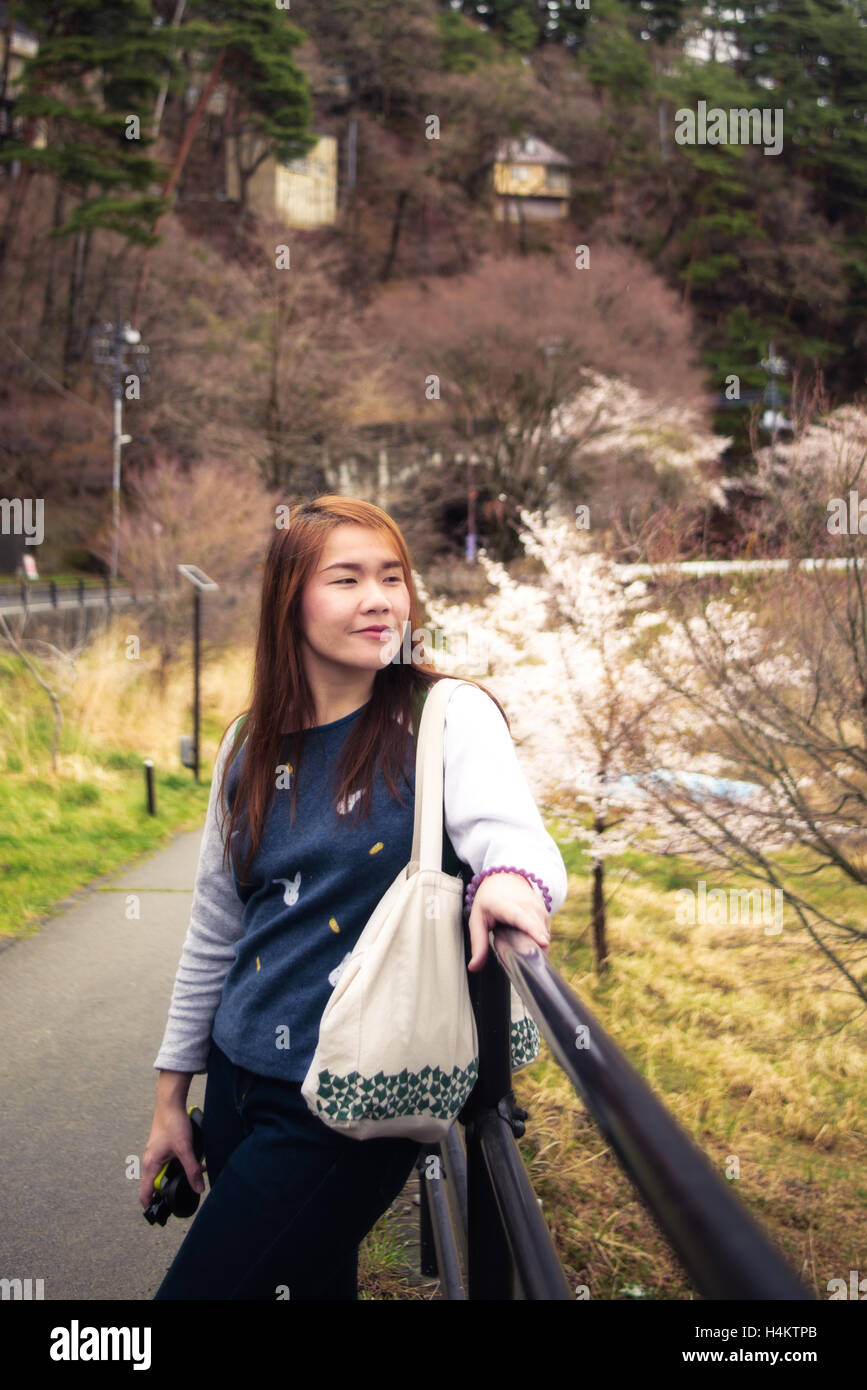 Long hair young Asia lady in park in japan Stock Photo - Alamy