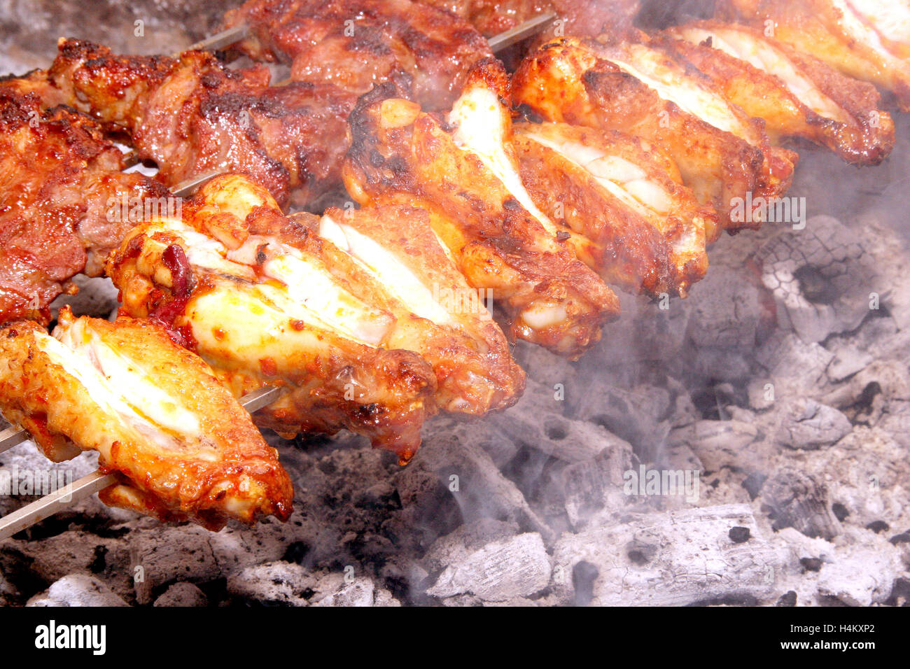 Wings on charcoal grill Stock Photo Alamy